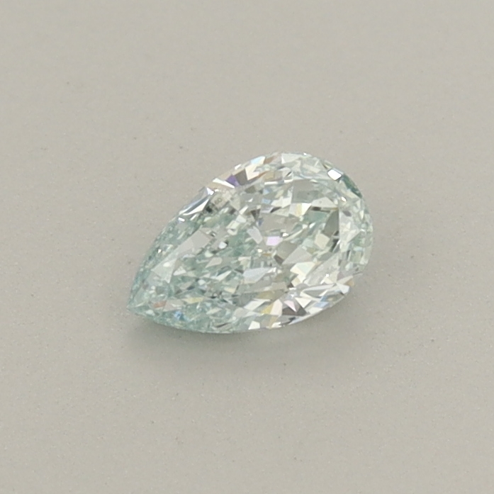 Actual 0.28 carat Fancy Intense Green Pear lab-grown diamond