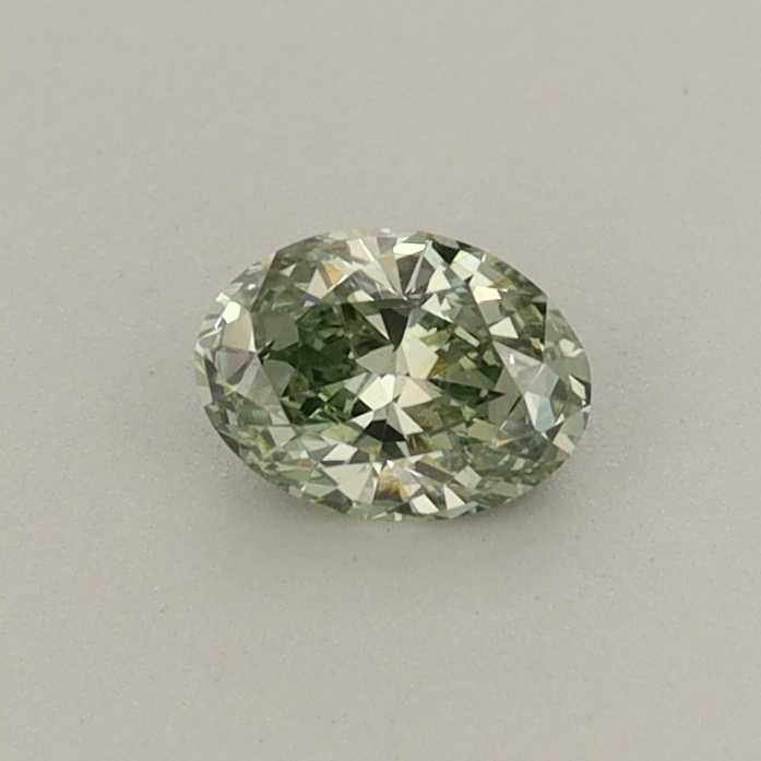 Actual 0.28 carat Fancy Vivid Green Oval lab-grown diamond