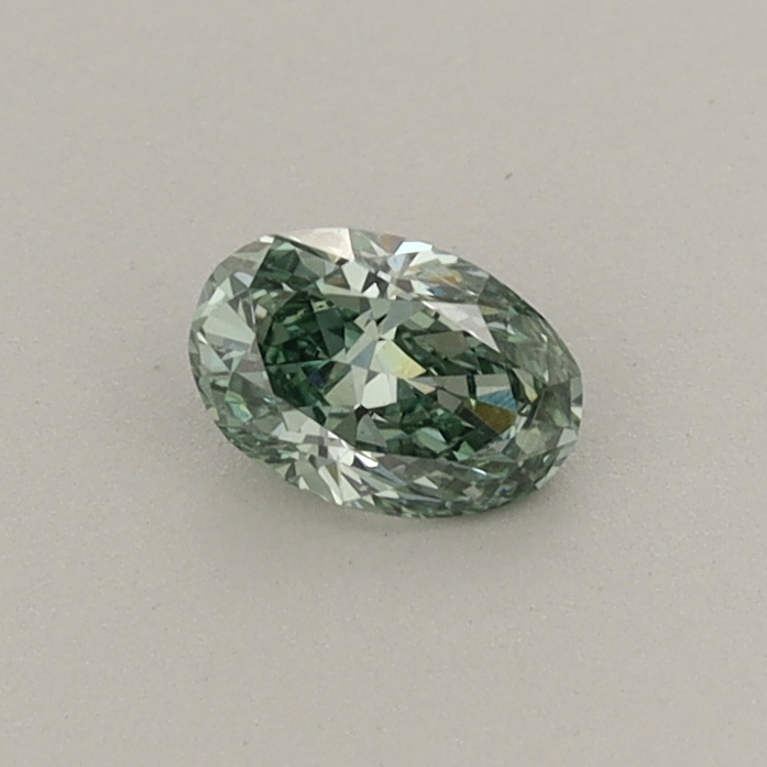 Actual 0.28 carat Fancy Vivid Green Oval lab-grown diamond