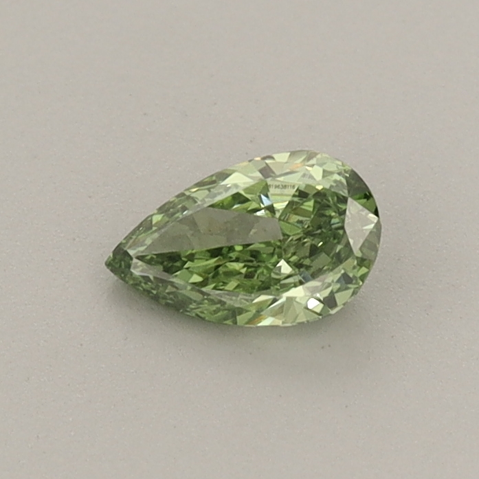 Actual 0.3 carat Fancy Vivid Green Pear lab-grown diamond