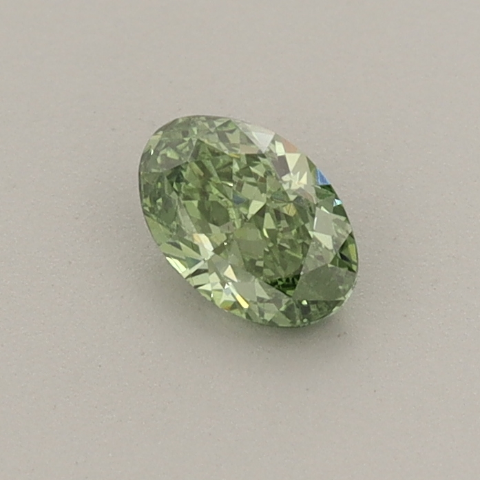 Actual 0.31 carat Fancy Vivid Green Oval lab-grown diamond