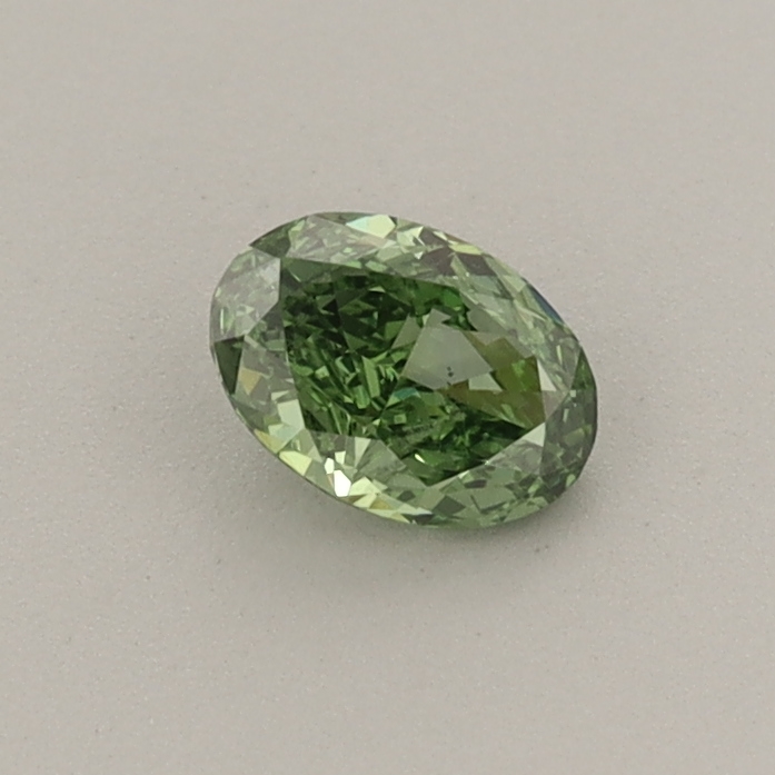 Actual 0.32 carat Fancy Vivid Green Oval lab-grown diamond