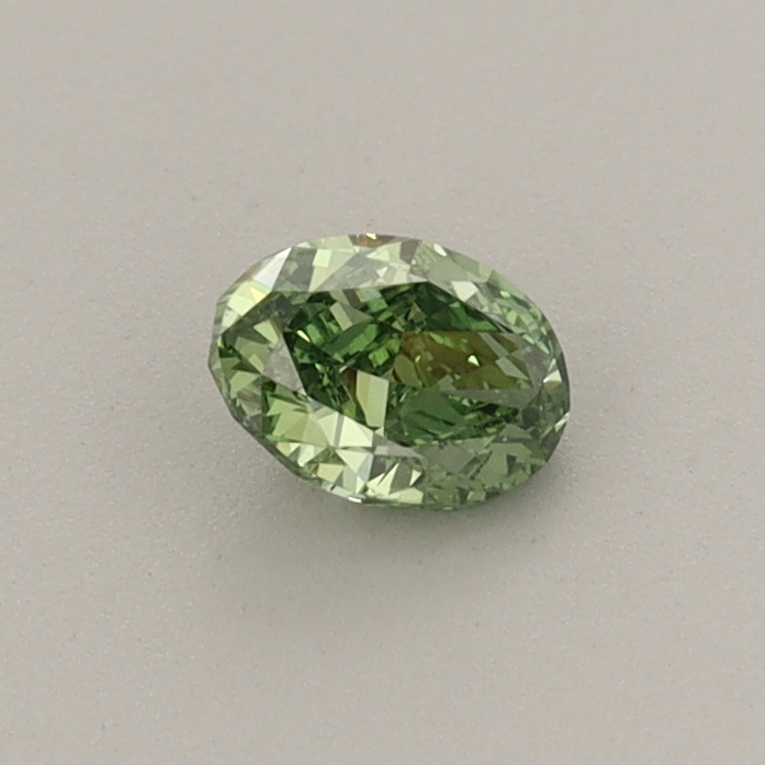 Actual 0.32 carat Fancy Vivid Green Oval lab-grown diamond