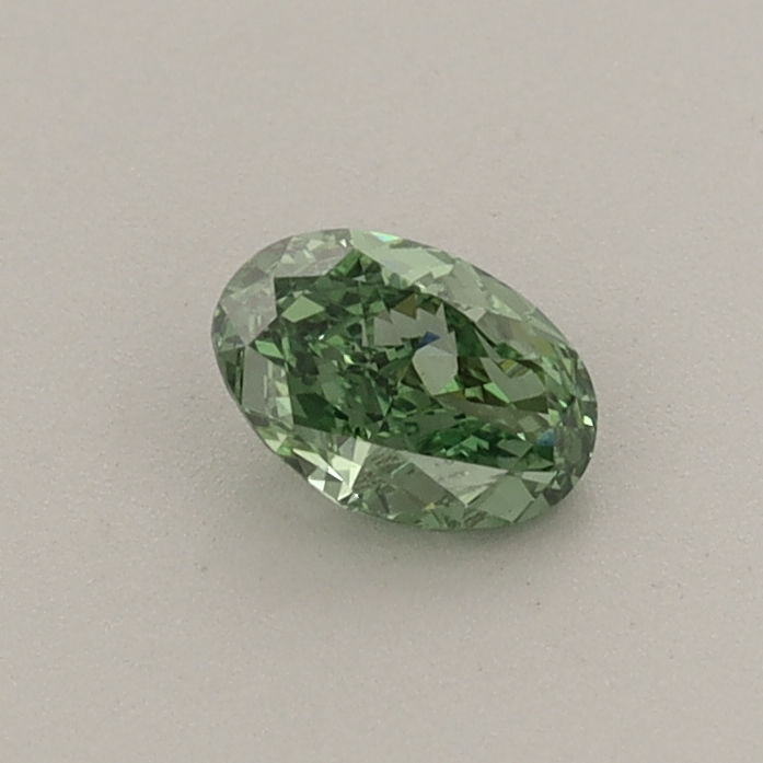 Actual 0.32 carat Fancy Vivid Green Oval lab-grown diamond