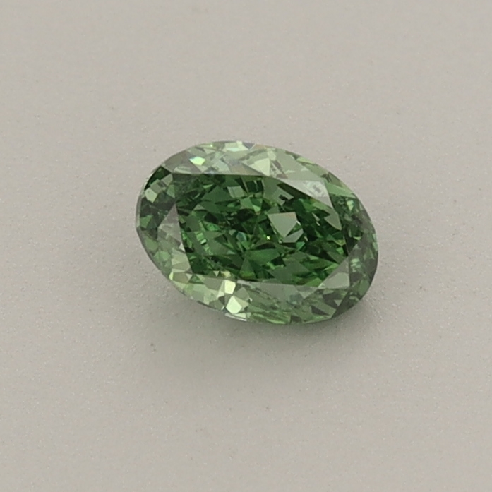Actual 0.33 carat Fancy Vivid Green Oval lab-grown diamond