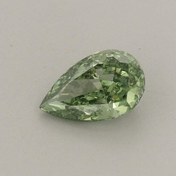 Actual 0.37 carat Fancy Vivid Green Pear lab-grown diamond