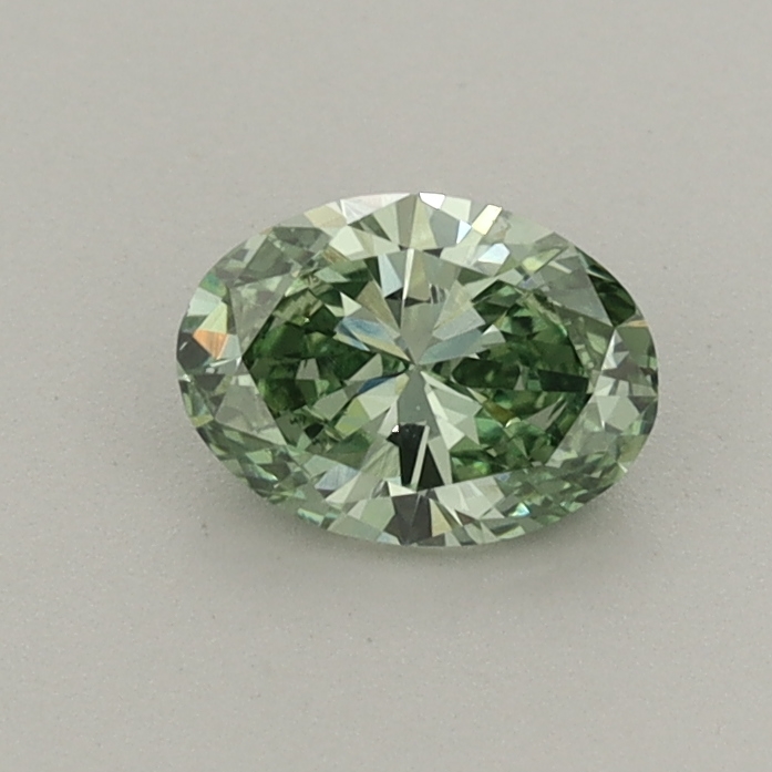 Actual 0.45 carat Fancy Vivid Green Oval lab-grown diamond