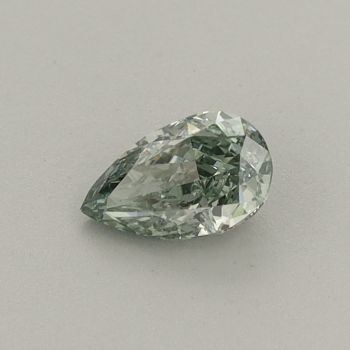 Actual 0.3 carat Fancy Vivid Green Pear lab-grown diamond