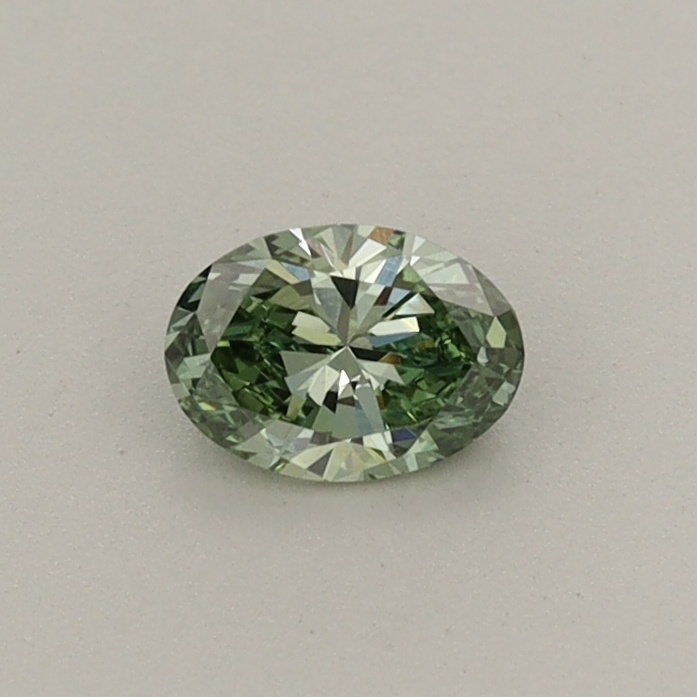 Actual 0.26 carat Fancy Vivid Green Oval lab-grown diamond