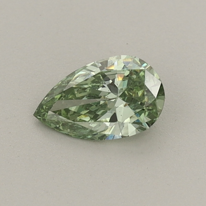 Actual 0.32 carat Fancy Vivid Green Pear lab-grown diamond