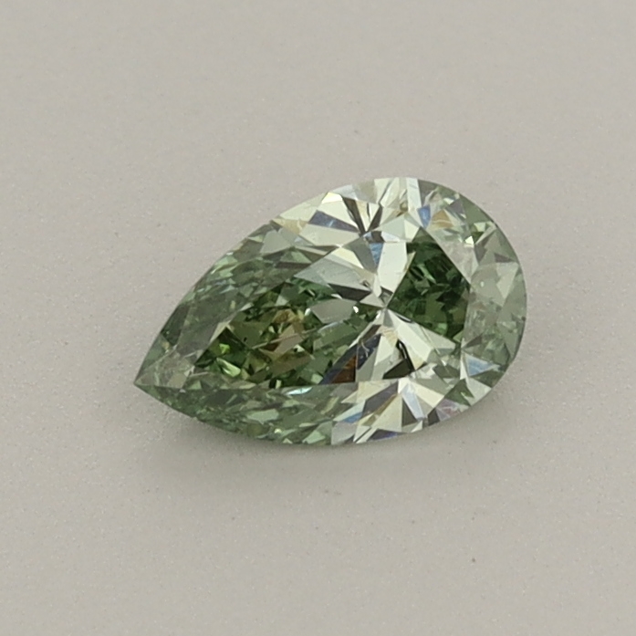 Actual 0.35 carat Fancy Vivid Green Pear lab-grown diamond