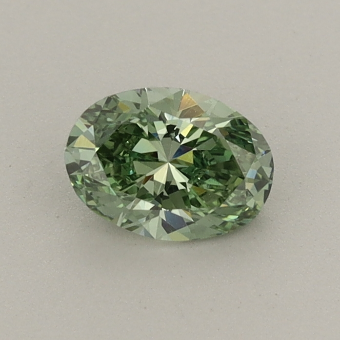Actual 0.47 carat Fancy Vivid Green Oval lab-grown diamond