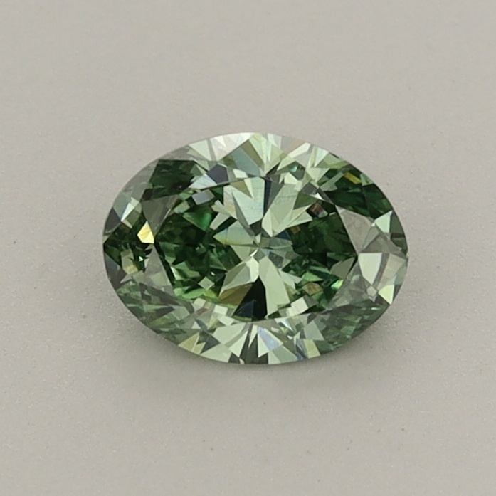 Actual 0.47 carat Fancy Vivid Green Oval lab-grown diamond