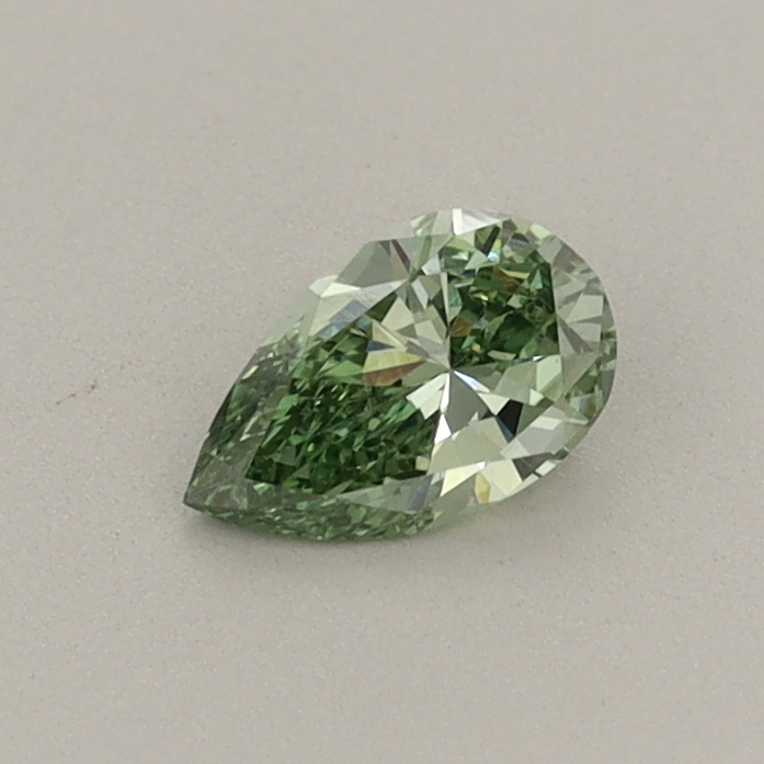 Actual 0.29 carat Fancy Vivid Green Pear lab-grown diamond