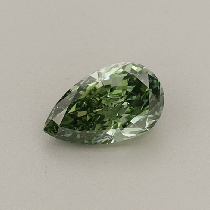 Actual 0.36 carat Fancy Vivid Green Pear lab-grown diamond