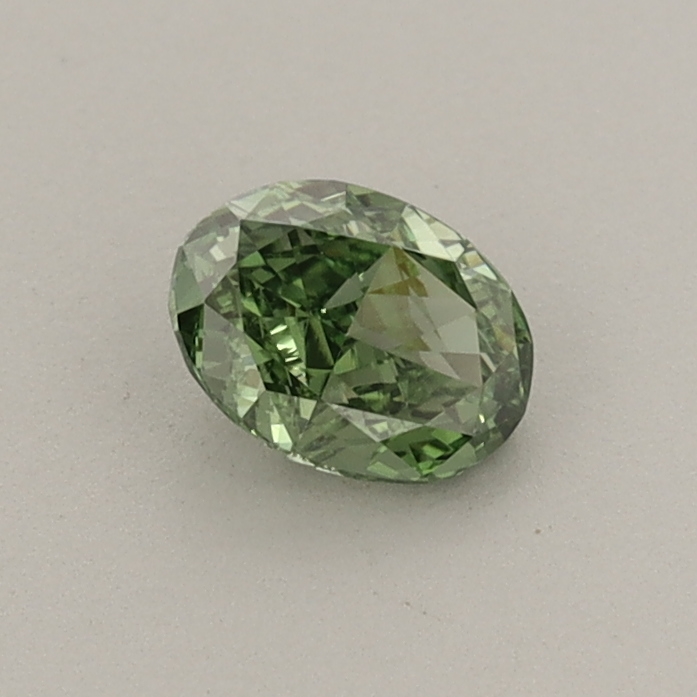 Actual 0.41 carat Fancy Vivid Green Oval lab-grown diamond
