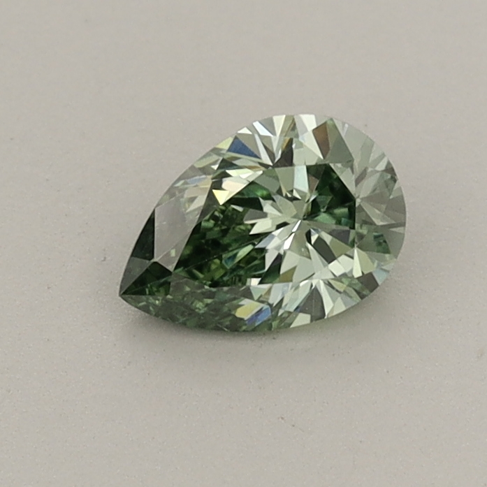 Actual 0.41 carat Fancy Vivid Green Pear lab-grown diamond