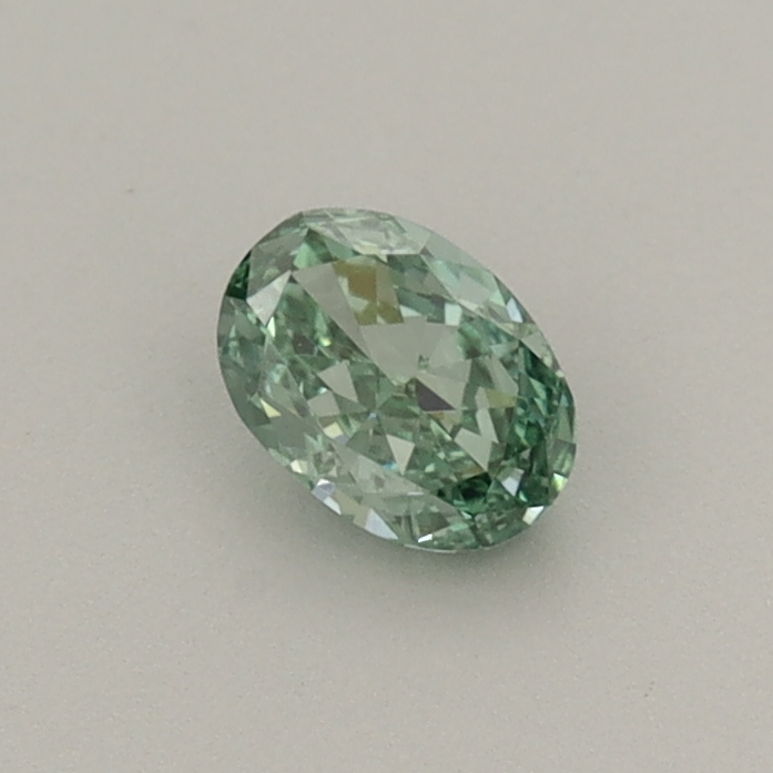 Actual 0.31 carat Fancy Vivid Green Oval lab-grown diamond