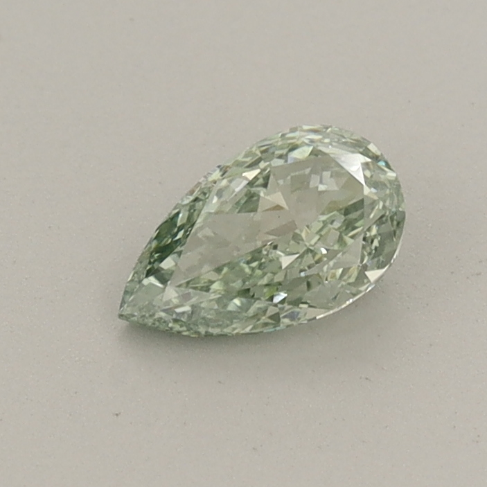 Actual 0.39 carat Fancy Vivid Green Pear lab-grown diamond