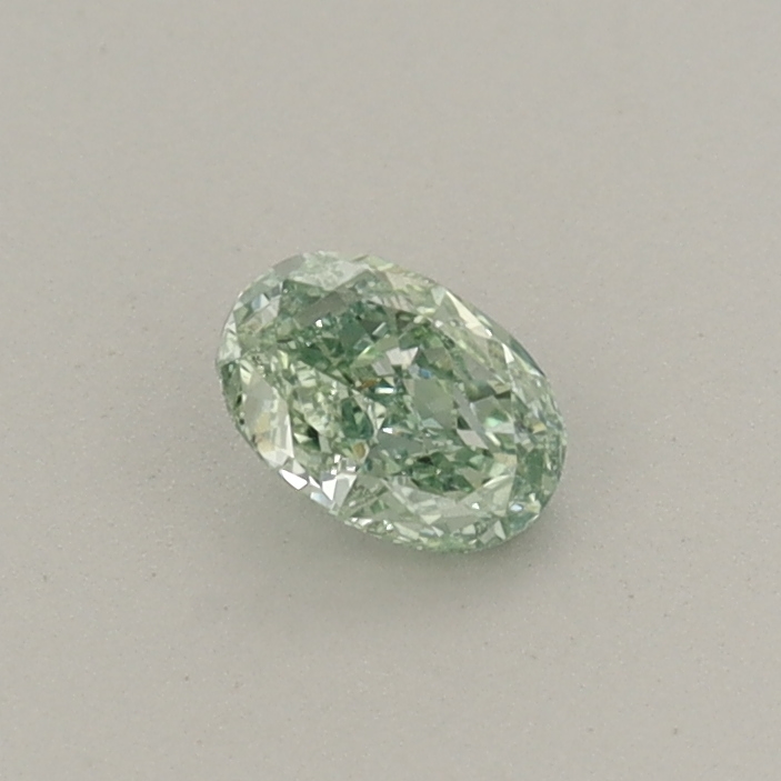 Actual 0.23 carat Fancy Vivid Green Oval lab-grown diamond