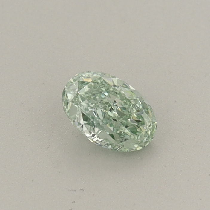 Actual 0.26 carat Fancy Vivid Green Oval lab-grown diamond