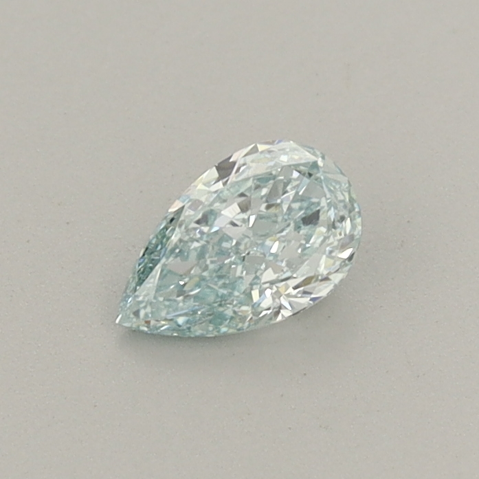 Actual 0.31 carat Fancy Vivid Green Pear lab-grown diamond