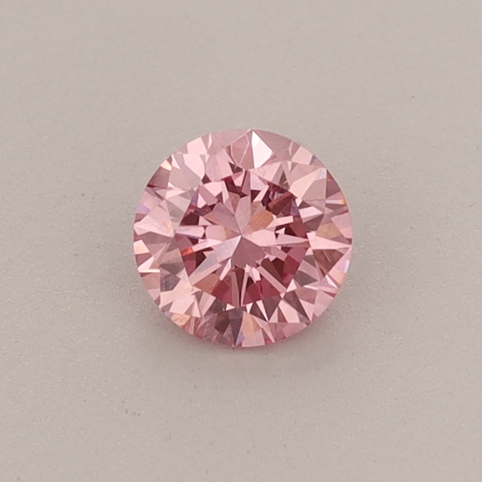 Actual 0.32 carat Fancy Vivid Pink Round lab-grown diamond
