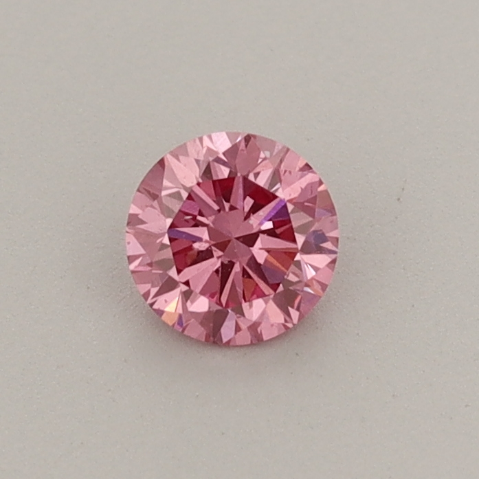 Actual 0.31 carat Fancy Vivid Pink Round lab-grown diamond