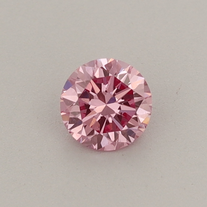 Actual 0.31 carat Fancy Vivid Pink Round lab-grown diamond