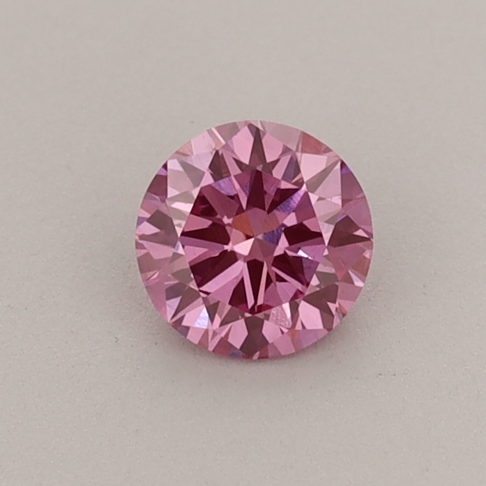 Actual 0.39 carat Fancy Vivid Pink Round lab-grown diamond