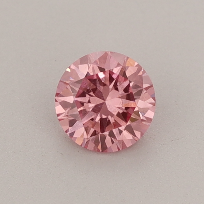 Actual 0.42 carat Fancy Vivid Pink Round lab-grown diamond