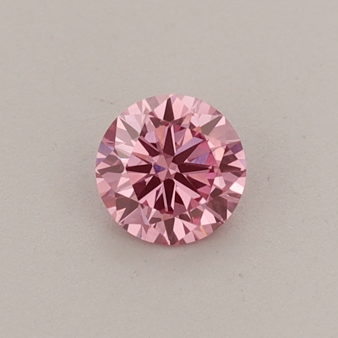 Actual 0.29 carat Fancy Vivid Pink Round lab-grown diamond