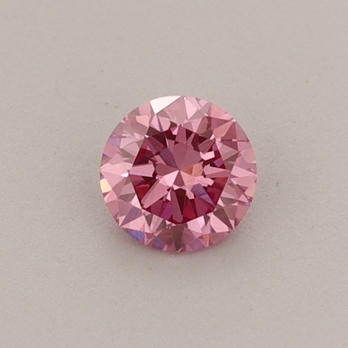 Actual 0.32 carat Fancy Vivid Pink Round lab-grown diamond