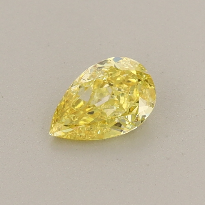 Actual 0.29 carat Fancy Vivid Yellow Pear lab-grown diamond