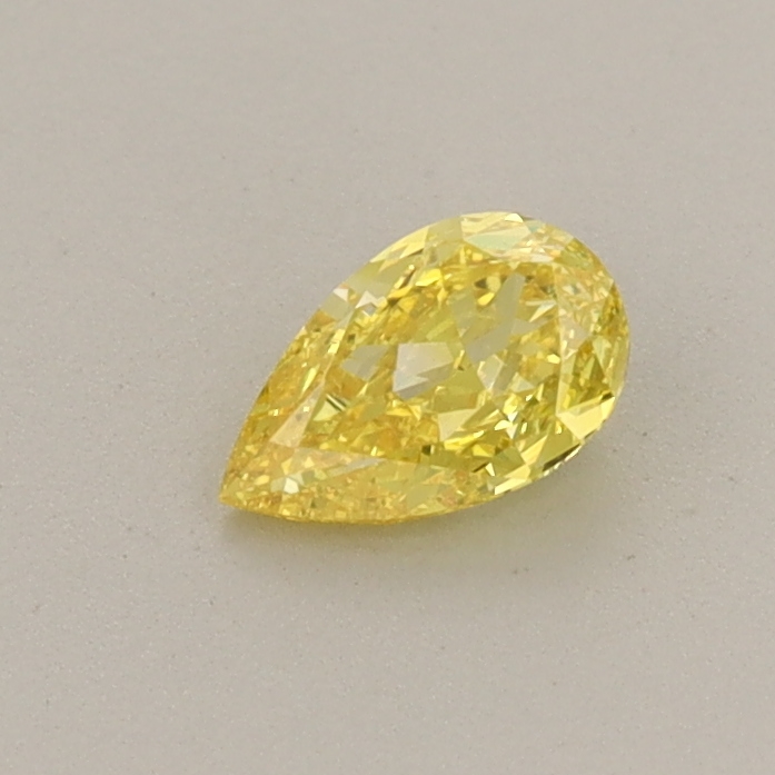Actual 0.31 carat Fancy Vivid Yellow Pear lab-grown diamond