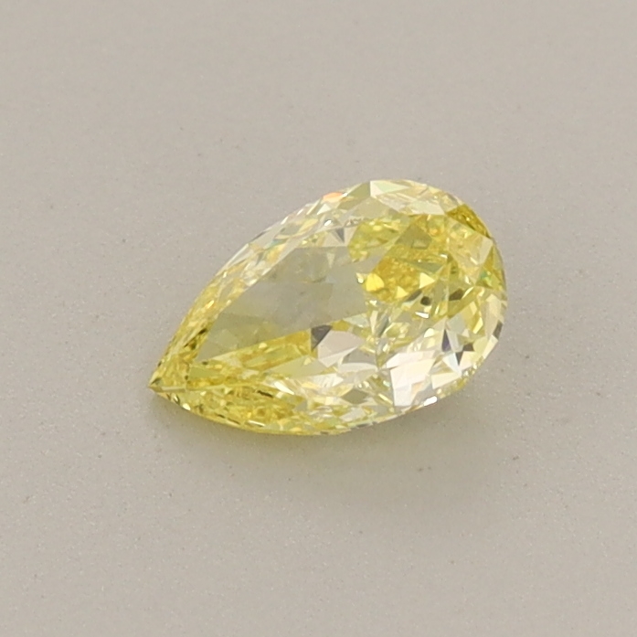 Actual 0.36 carat Fancy Intense Yellow Pear lab-grown diamond