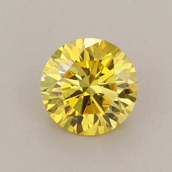 Actual 0.7 carat Vivid Yellow Round lab-grown diamond