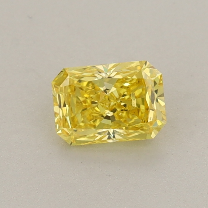 Actual 0.42 carat Fancy Vivid Yellow Radiant lab-grown diamond
