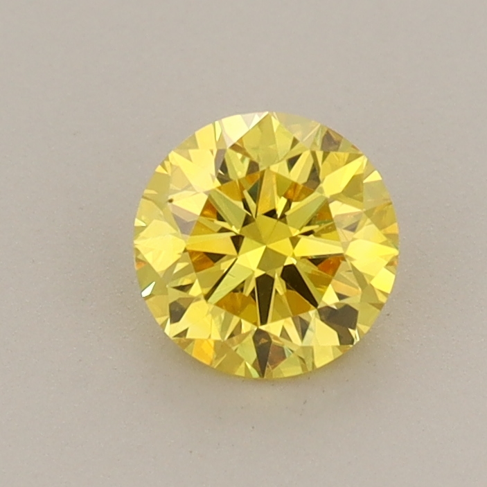 Actual 0.57 carat Vivid Yellow Round lab-grown diamond