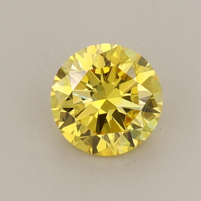 Actual 0.59 carat Vivid Yellow Round lab-grown diamond