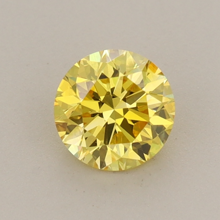 Actual 0.59 carat Vivid Yellow Round lab-grown diamond