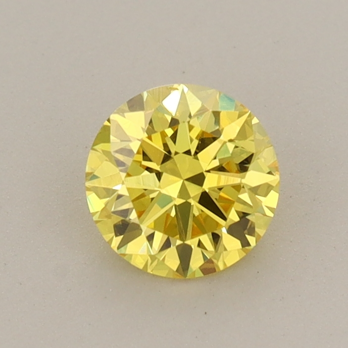 Actual 0.59 carat Vivid Yellow Round lab-grown diamond