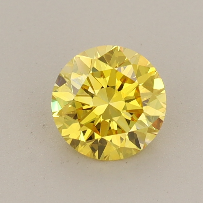 Actual 0.63 carat Vivid Yellow Round lab-grown diamond