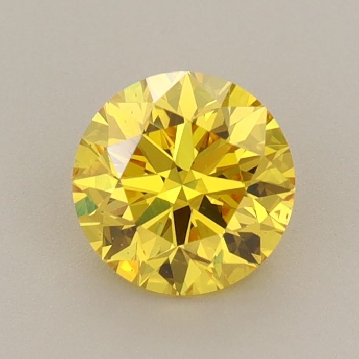 Actual 0.83 carat Vivid Yellow Round lab-grown diamond