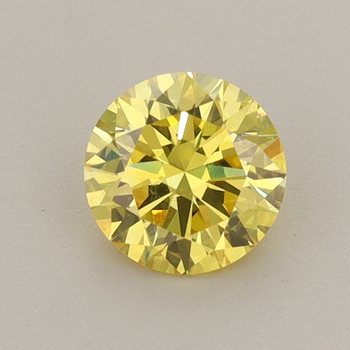 Actual 0.76 carat Vivid Yellow Round lab-grown diamond