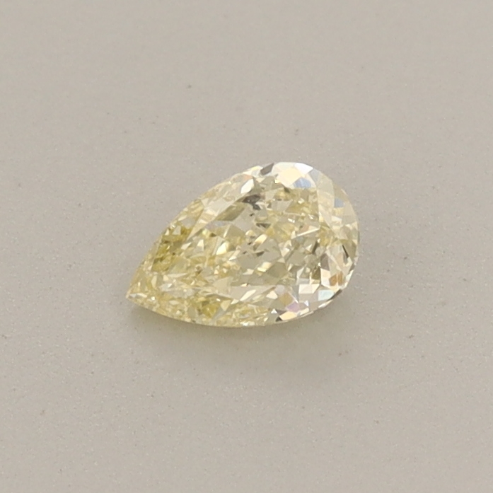 Actual 0.24 carat Fancy Yellow Pear lab-grown diamond