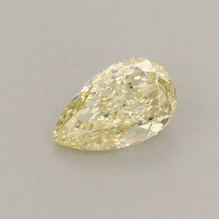 Actual 0.32 carat Fancy Yellow Pear lab-grown diamond